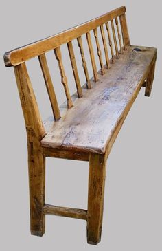 a wooden bench sitting on top of a gray background