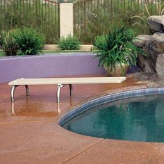 a pool with a bench next to it