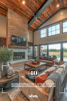 a living room with lots of furniture and large windows in the ceiling, along with an open fire place