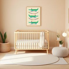 a baby's room with a crib, rug and potted plant on the floor