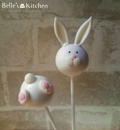 there are two cake pops shaped like bunnies