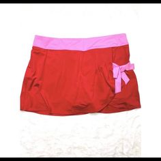 Adorable And Never Worn Fila Tulip Tennis Skirt In Red/Pink. Shorts Attached. Size M Red Lined Skirt Bottoms For Summer, Red Lined Skirt For Summer, Stretchable Pink Skirt For Vacation, Pink Stretch Skirt For Vacation, Stretch Pink Skirt For Vacation, Red Stretch Skirt For Vacation, Fitted Pink Skort For The Beach, Pink Mini Skirt For Vacation, Pink Skirted Skort For Vacation