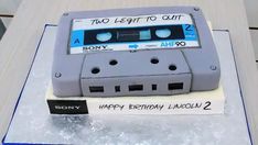 a cake made to look like an old school cassette tape recorder with the words happy birthday lincoln on it