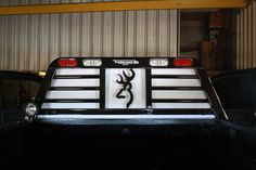 the back end of a truck with an antelope decal on it