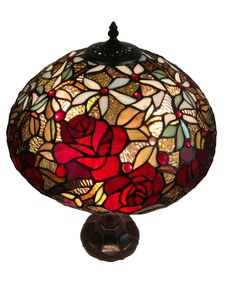 a red rose lamp sitting on top of a table