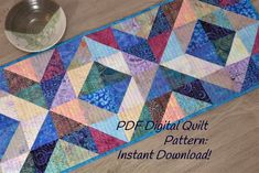 a quilted table runner with a bowl on it and the words pdd digital quilt pattern instant download