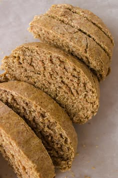 some kind of bread that is cut in half and stacked on top of each other