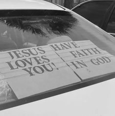 the back window of a car with a sign on it that says jesus have loves, faith, you in god