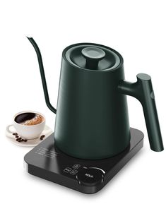 a green coffee pot sitting on top of a stove next to a cup of coffee