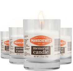 three candles sitting next to each other in front of a white background with an orange label