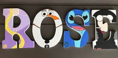 the word roo spelled with cut out letters in front of an image of cartoon characters