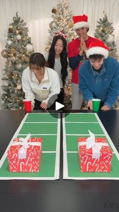 a group of people standing around a table with presents on it