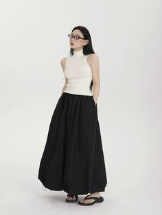 Make a fashion-forward statement with the High-Waisted Balloon Maxi Skirt with Pockets, a contemporary twist on classic femininity. Crafted for effortless charm, this skirt's high waist design cinches to define your silhouette, while the balloon-inspired maxi length billows with a carefree aesthetic. The crisp solid color palette and subtle sheen of the 100% polyester fabric complement the skirt's street-savvy style, while the convenience of pockets adds a practical touch. Dress it down with a t Bubble Maxi Skirt, Parachute Maxi Skirt, Maxi Bubble Skirt, Balloon Skirt Outfit 2024, Long Skirt Ootd, Balloon Skirt Outfit, Black Pleated Maxi Skirt, Black Maxi Skirt Outfit, Carefree Aesthetic