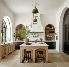 a large kitchen with an island in the middle