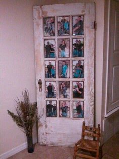 an old door with pictures on it and a plant in the corner next to it