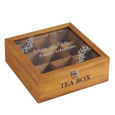 a wooden box with four tea boxes in it