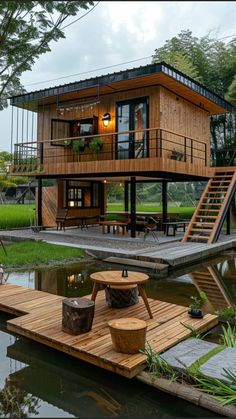 a house built into the side of a body of water next to a wooden dock