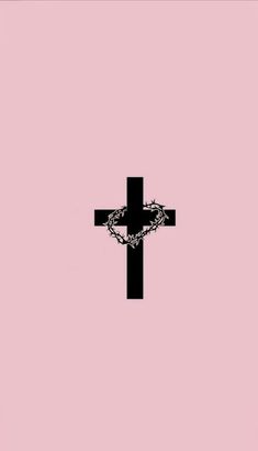 a cross with a chain on it against a pink background