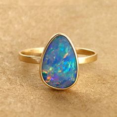 Fine Jewelry 14k Gold Opal Ring With Polished Finish, 14k Gold Opal Ring With Polished Finish, 14k Yellow Gold Opal Ring Birthstone, 14k Yellow Gold Opal Promise Ring, 14k Gold Opal Ring With Polished Finish For Promise, 14k Gold Opal Ring With Polished Finish For Anniversary, Heirloom 14k Gold Opal Ring With Bezel Setting, 14k Gold Opal Ring With Bezel Setting, Thick Gold Wedding Band