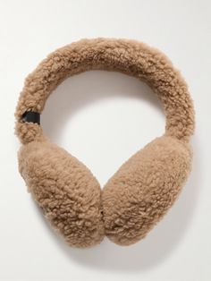 Yves Salomon creates elevated winter accessories that offer warmth without sacrificing style. These earmuffs are made from plush shearling in a light-brown hue that'll go with just about any color coat. Brown Earmuffs, Ear Muffs, Winter Accesories, Yves Salomon, Skincare Tools, Raffia Bag, Earmuffs, Beauty Accessories, Winter Accessories