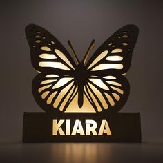 a light up butterfly with the word kara on it