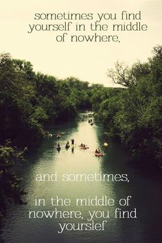 several people in canoes paddling down a river surrounded by green trees and bushes