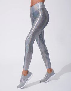 Make a statement with the iridescent fabric of the Marvel Legging. Marvel at the sheen on this legging and feel powerful and pretty at the same time. Show off at the gym or on the street.    High waistband lined with power mesh  Self: 80% NYLON 20% SPANDEX  Mesh lining  Made in USA  Model is wearing a size SMALL MACHIN Iridescent Fabric, Feel Powerful, Gym Pants, Red Leggings, Shiny Leggings, Black Halo, Functional Fashion, Metallic Fabric, Large Dress