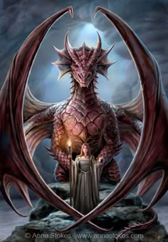 a red dragon sitting on top of a rock next to a person holding a lit candle