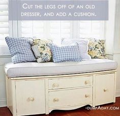 a white bench with pillows on it in front of a window that says cut the legs off an old dresser, and add a cushion