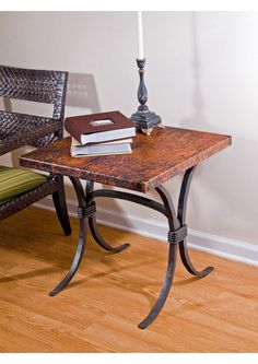 a table with two chairs and a book on it