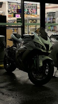 a motorcycle parked in front of a store