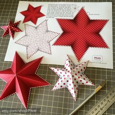 some red and white paper stars on a table