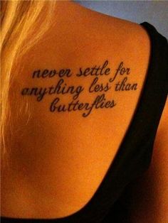 the back of a woman's shoulder with a tattoo saying never state for anything less than butterflies