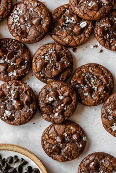 salted brownie crinkle cookies on a baking sheet with text overlay