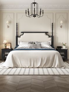 a bedroom with a bed, nightstands and chandelier hanging from the ceiling