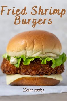 a fried shrimp burger with cheese and lettuce