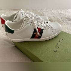 Pair Of Gucci Ace Sneakers In Excellent Condition. Purchased At The Gucci Store (Saint Honor Near Rue Madeleine) In Paris In November, 2022. Worn Twice (Only Once Outdoors). Minimal (If Any) Wear On Soles. No Scuffs Or Marks. Both Shoes Have Their Own Dust Bag. Original Box Included With Original Ribbon. Extra Set Of Laces (Unopened) Also Included. White Gucci Slip-on Sneakers, Gucci Cream Low-top Sneakers, Gucci Low-top Custom Sneakers For Sports, Gucci Custom Lace-up Sneakers With Logo Print, Gucci Low-top Custom Sneakers For Streetwear, Paris In November, Gucci Lace-up Sneakers With Embroidered Logo, Gucci Ace Sneakers, Gucci Store