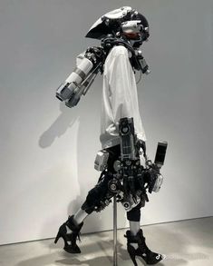 a mannequin dressed in all black and white with lots of gadgets on it