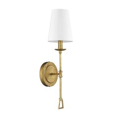 a wall light with a white shade on the side and a gold metal arm that is attached to it