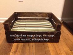 a wooden crate with a striped pillow in it's bottom and the words from best you design, i design, no design, custom paint to no additional charge