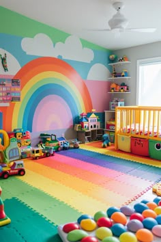 a child's playroom with rainbow colored carpet and walls painted in bright colors