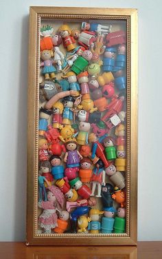 there is a framed picture with many toys in it