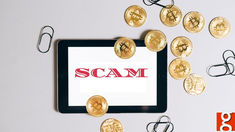 a tablet with the word scam on it surrounded by bitcoins