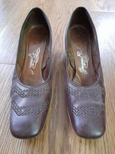 Lovely pair of brown shoes with small heels and decorative cutout design. They are marked Jacques Cardin Paris. The size is marked as 9 1/2 but they seem smaller to me so please check the measurements below carefully. Measurements are approximately: Insole: 10" Width taken at the widest of the outer sole:  2 7/8" Good used vintage condition with some expected scuffs etc due to use and age. You will most likely want to replace the lifts on the heels as the nail head are visible. Small Heels, Womens Pumps, Cutout Design, Nail Head, Brown Shoes, Brown Shoe, Vintage Shoes, Vintage 1960s, Womens Heels