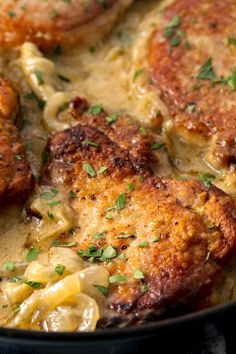 some food is cooking in a skillet on the stove and ready to be eaten