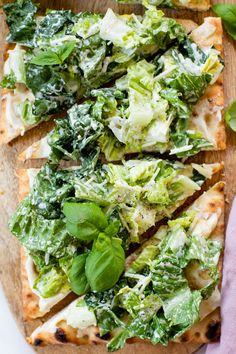 flatbread pizza topped with greens and cheese