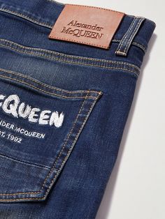 Leaning into the label's rock 'n' roll mood, Alexander McQueen's 'Graffiti' jeans are decorated with the brand's name in embroidered stitches. They're made from blue denim in a straight-leg fit. Luxury Straight Leg Jeans With Logo Patch, Denim Leather Patch, Graffiti Jeans, Luxury Rugged Washed Jeans, Embroidered Stitches, Luxury Denim Blue Men's Jeans, Alexander Mcqueen Blue, Denim Label, Alexander Mcqueen Clothing