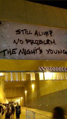 there is a sign that says still alive, no problem the night's young