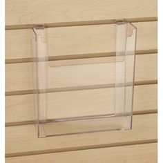 a clear acrylic display case on a wooden wall with wood slats in the background