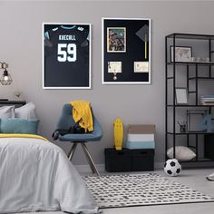 a bedroom with a soccer jersey on the wall